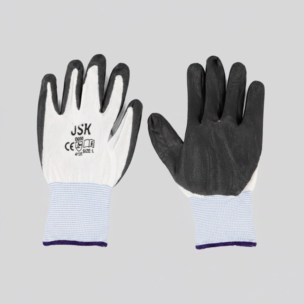 A pair of work gloves shown front and back on a plain white background. The left glove shows the white knitted back with black fingertips and the brand name 'JSK' printed on it, while the right glove shows the black-painted palm side with a light blue and white checkered wrist cuff.